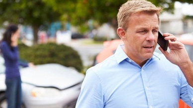 Guy on phone after an accident