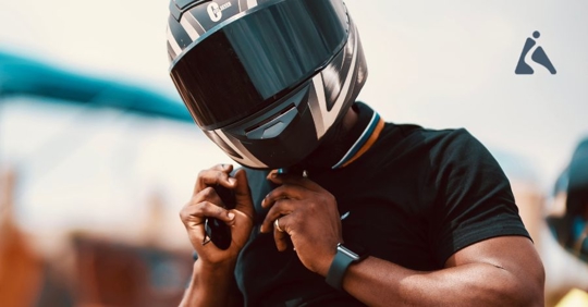 motorcycle rider taking off helmet